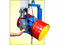 Close up of a hand pressing a switch to operate a below hook kontrol karrier for drum handling.